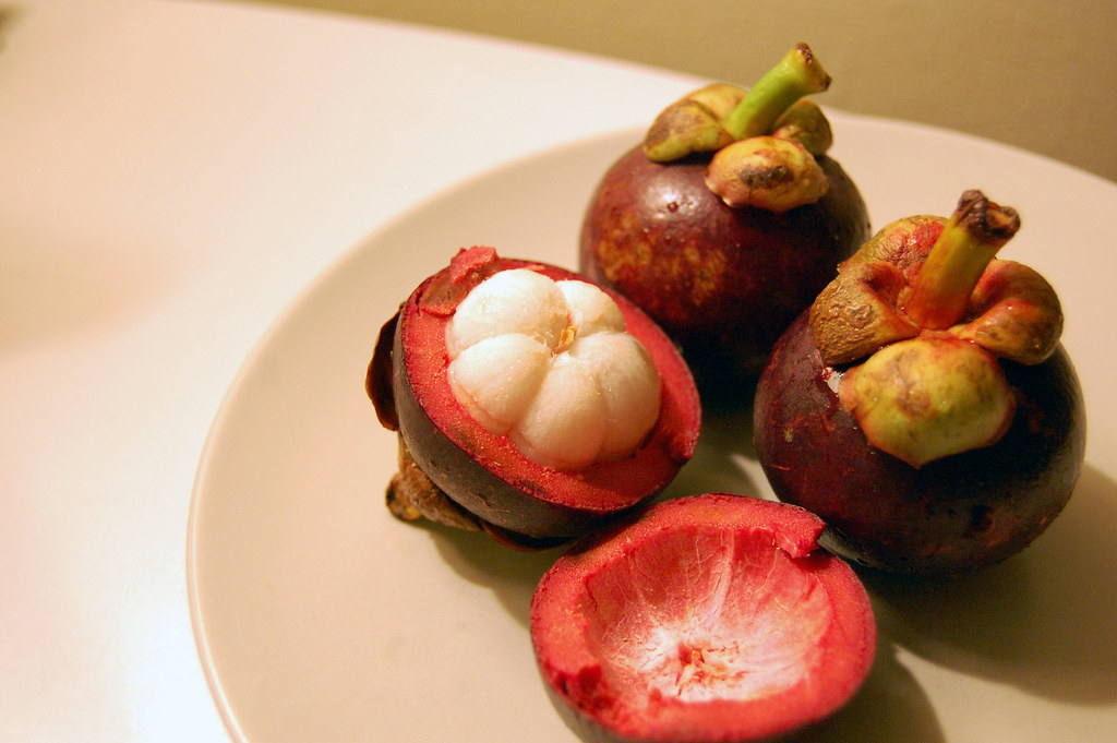 Inside, the delicate, flavorful Mangosteen.